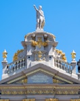 a statue of a man on top of a building