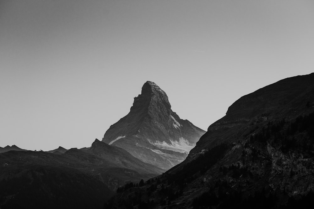 a black and white photo of a mountain