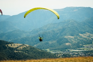 Enjoying Scenic View of Kullu City While Flying Over It - Paragliding in kullu