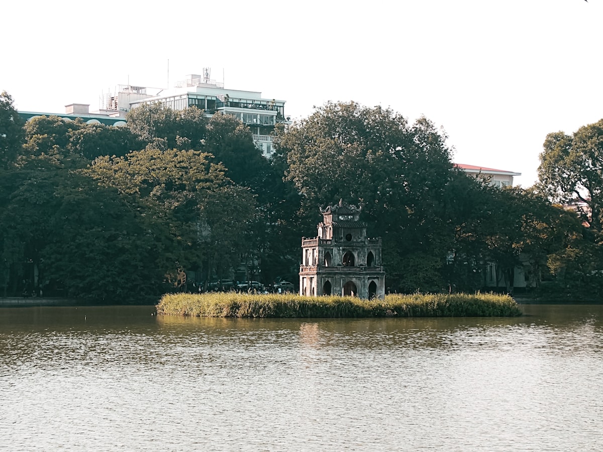 Hanoi January — Turtle Tower rising from the mist over Hoan Kiem Lake in the cool winter season