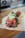 Close-up of a colorful taco with fresh ingredients on a rustic wooden table.