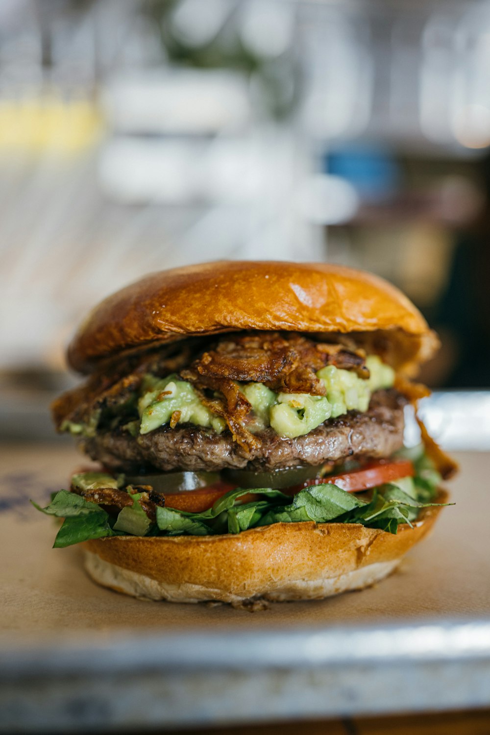 a sandwich with meat, lettuce and tomato on a tray