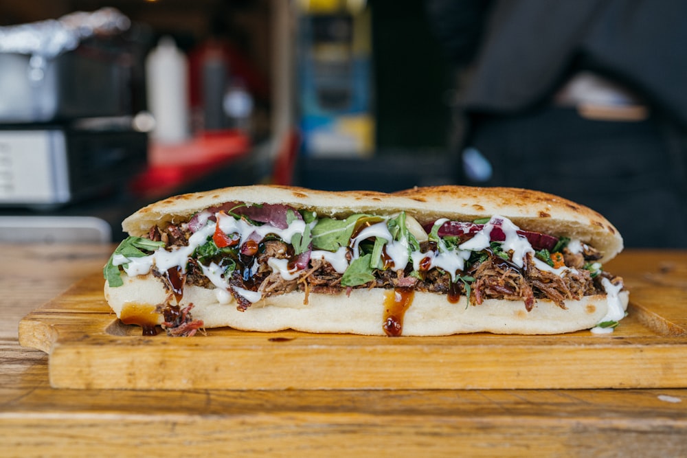 a close up of a sandwich on a cutting board