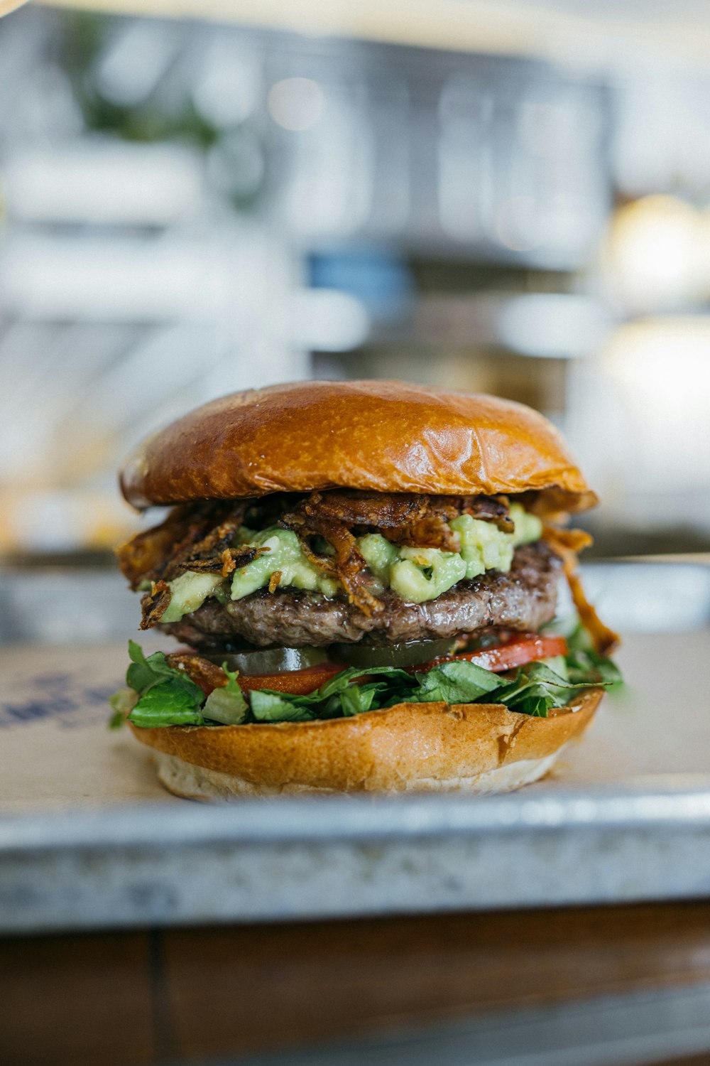 a sandwich with meat, lettuce and tomato on a tray