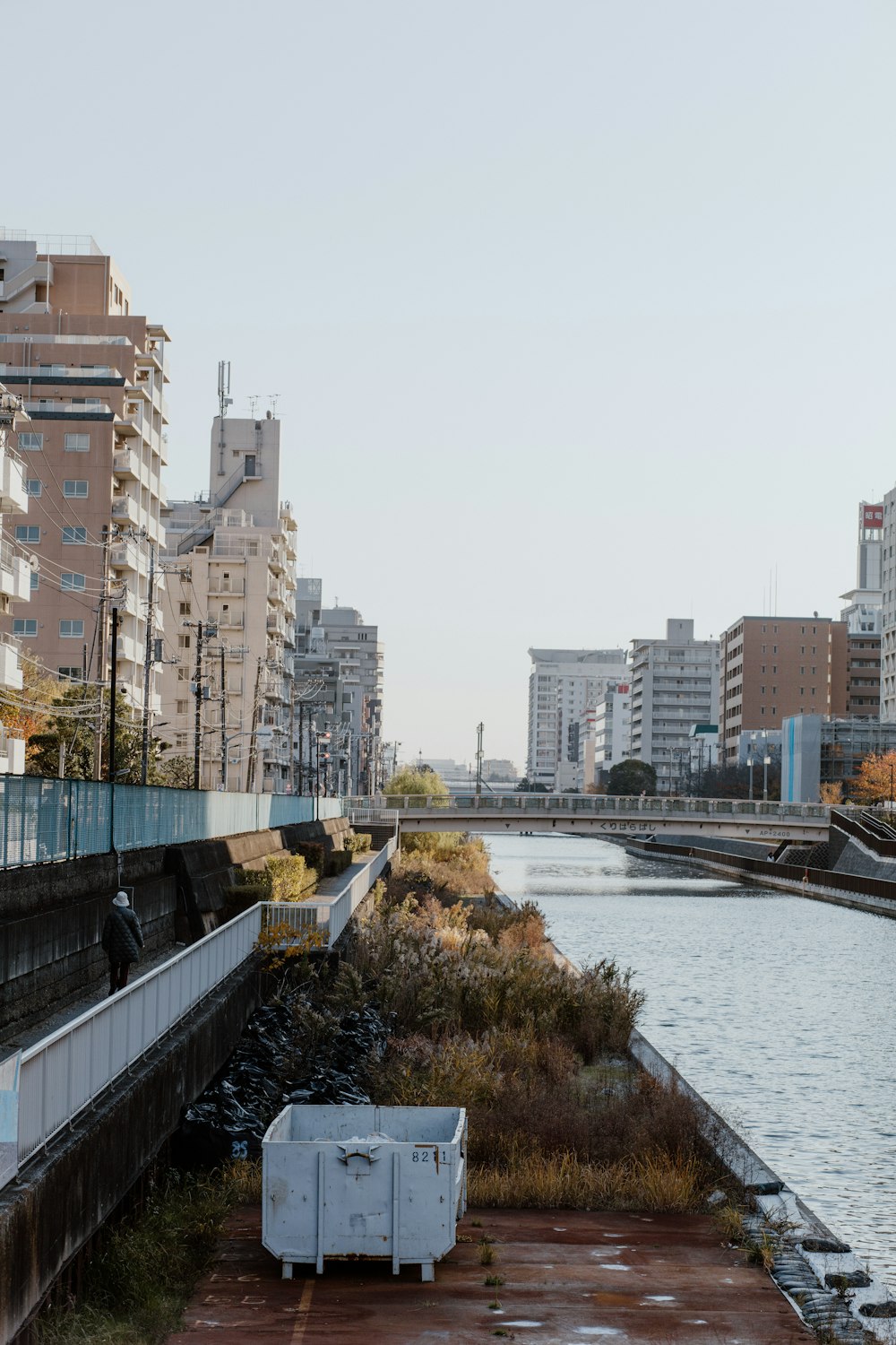 a body of water surrounded by tall buildings