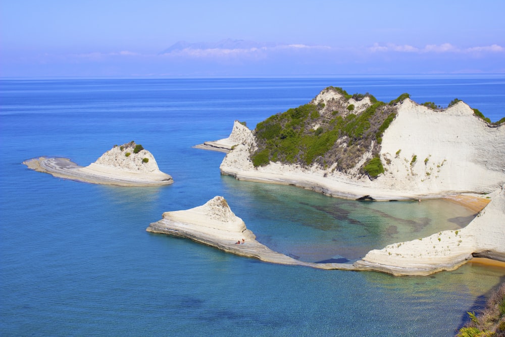 a body of water surrounded by white cliffs