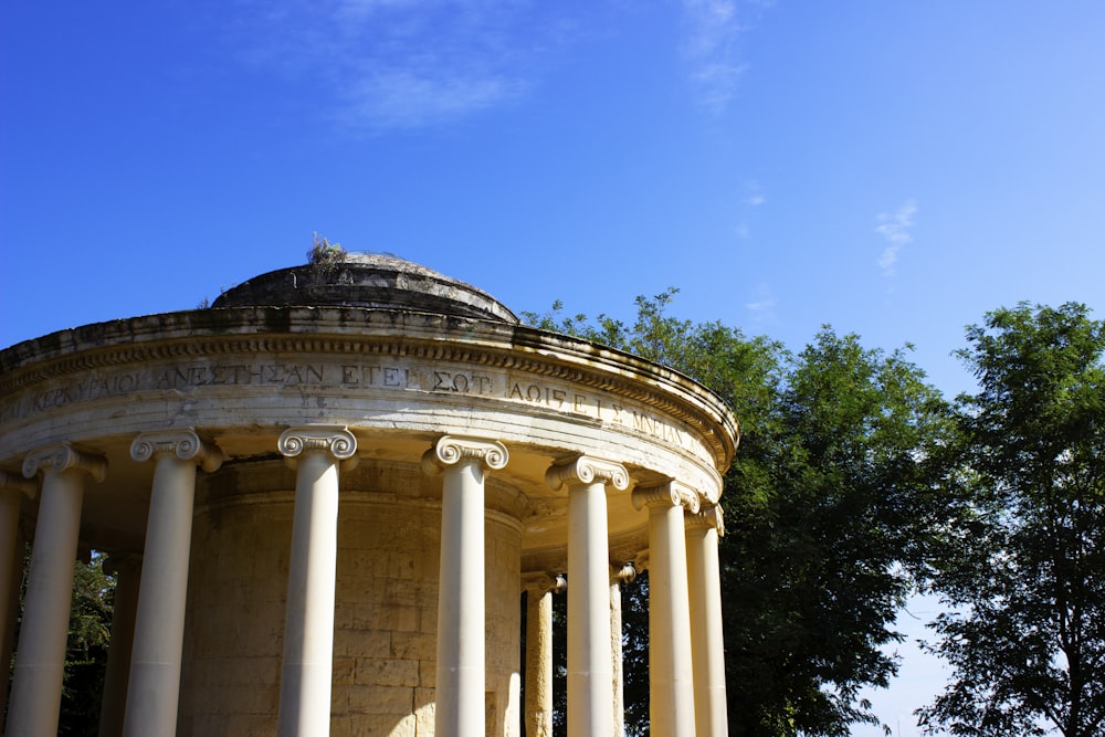 an old building with columns and a dome