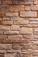 Close-up of tumbled limestone with subtle color variations and a rustic feel.