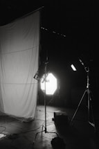 A warm, inviting photography studio setup with camera gear and soft lighting.