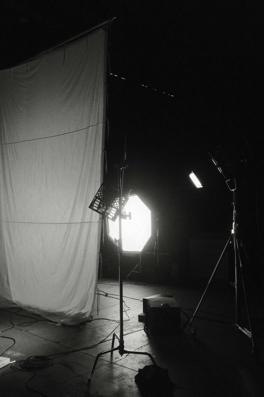 a black and white photo of a light in a dark room