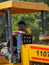 a man is sitting on a fork lift