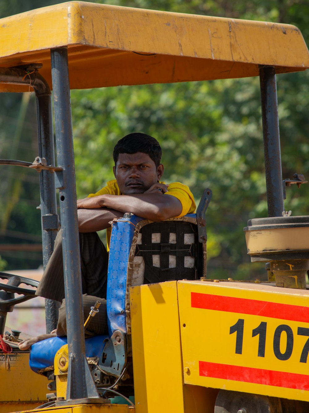 a man is sitting on a fork lift