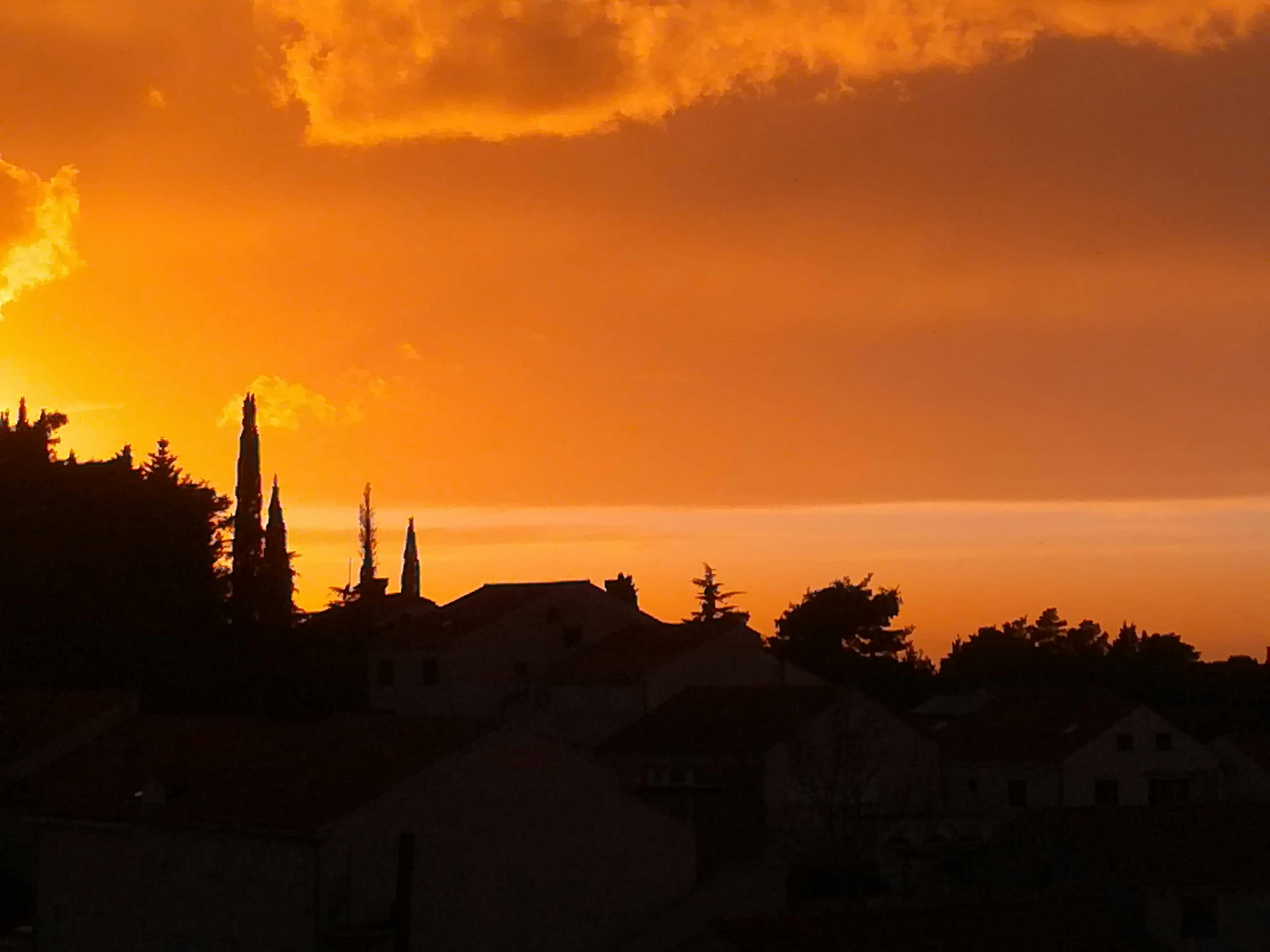 The sun is setting over a small town