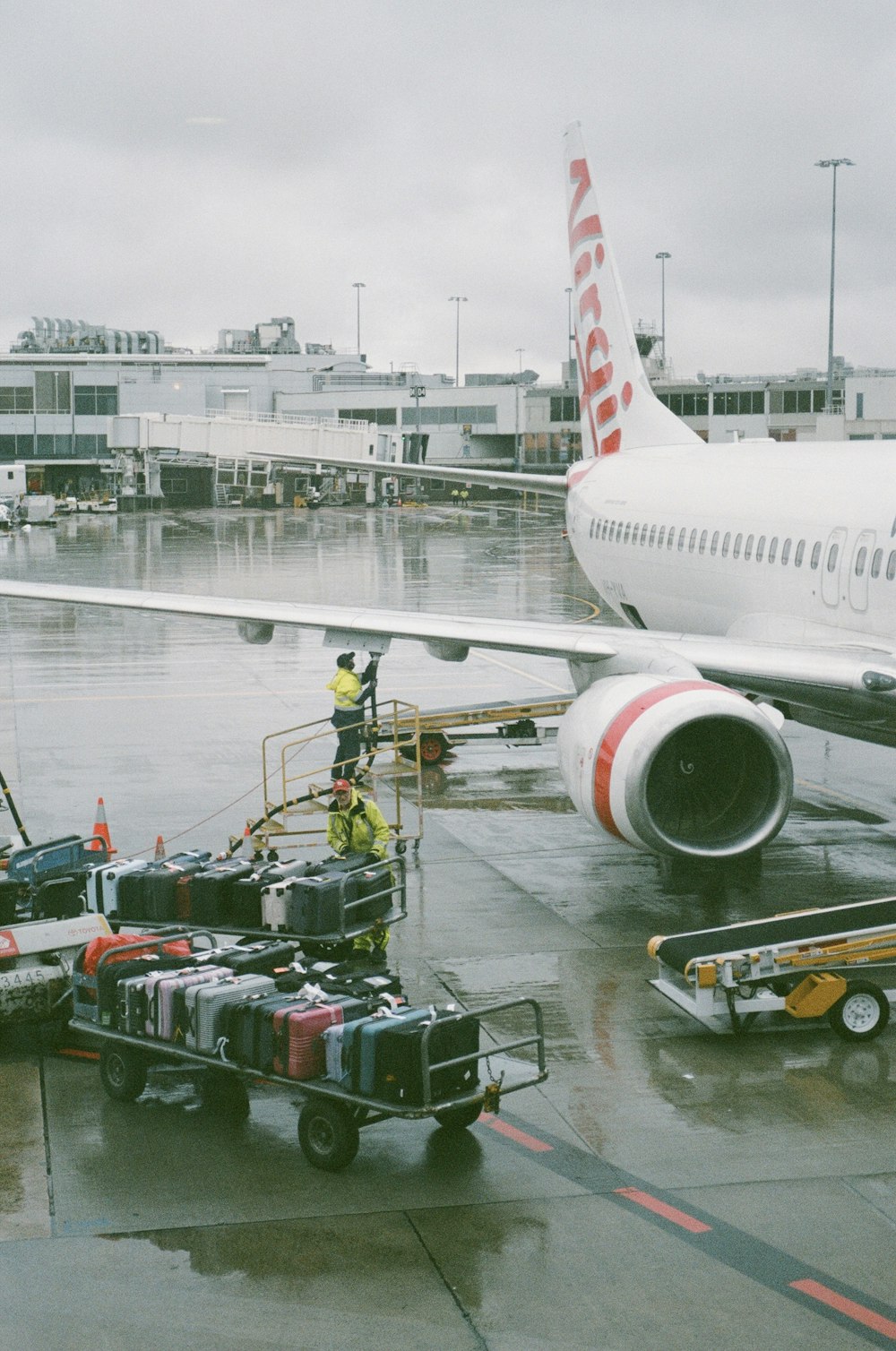 a large jetliner sitting on top of an airport tarmac