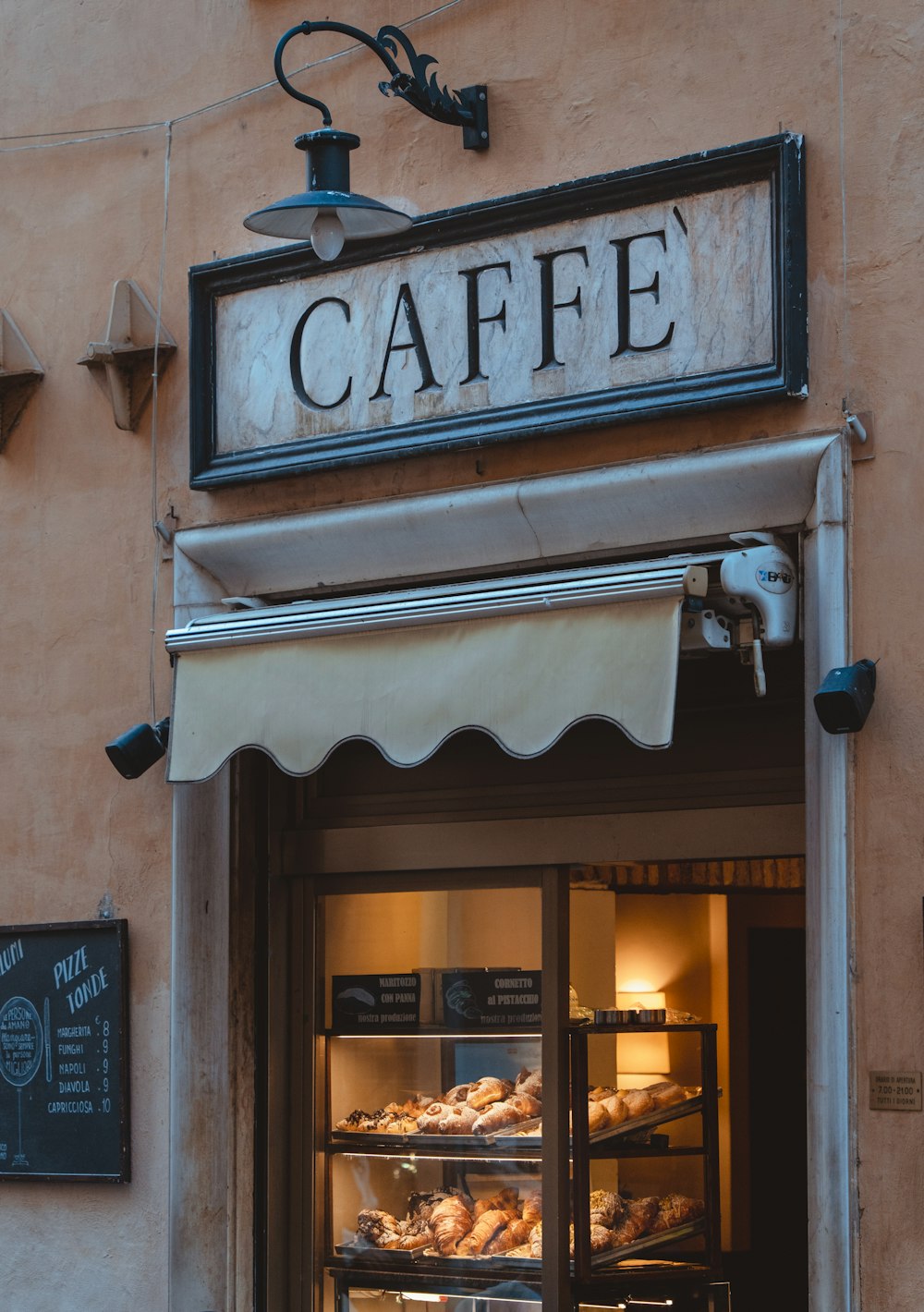 a bakery with a sign above it that says cafe