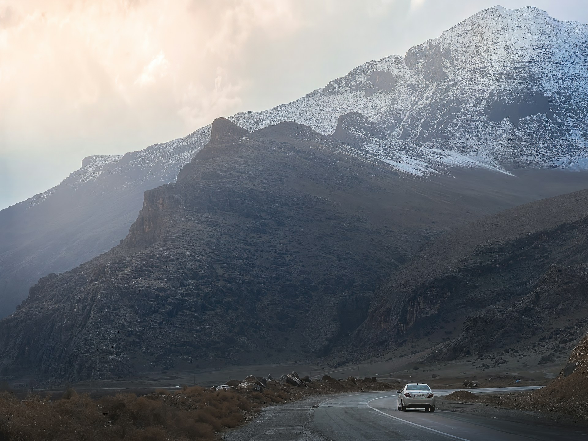 woman wearing yellow long-sleeved dress under white clouds and blue sky during daytime