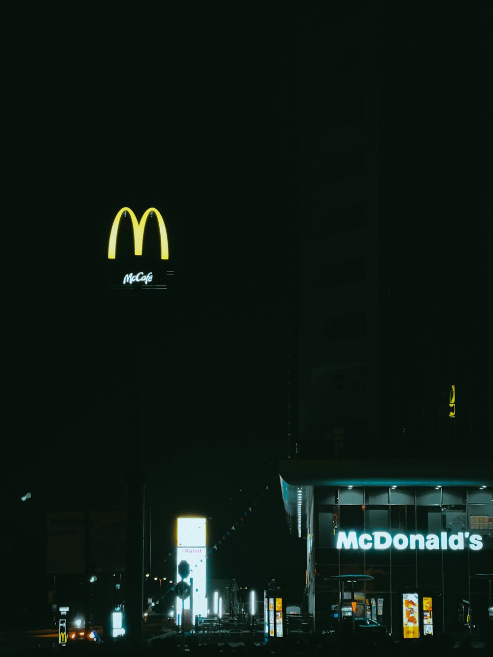 a mcdonald's restaurant lit up at night