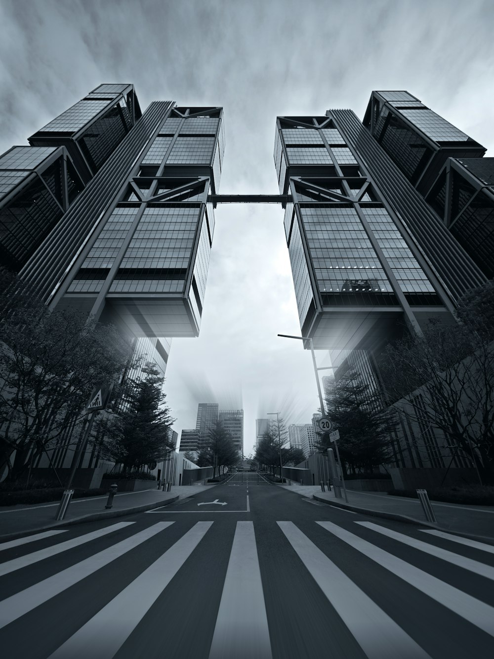 a black and white photo of two tall buildings