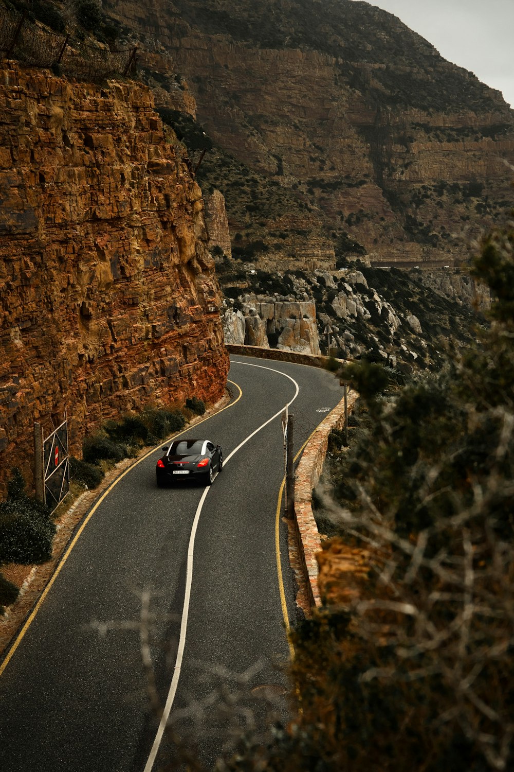 a car driving down a winding mountain road