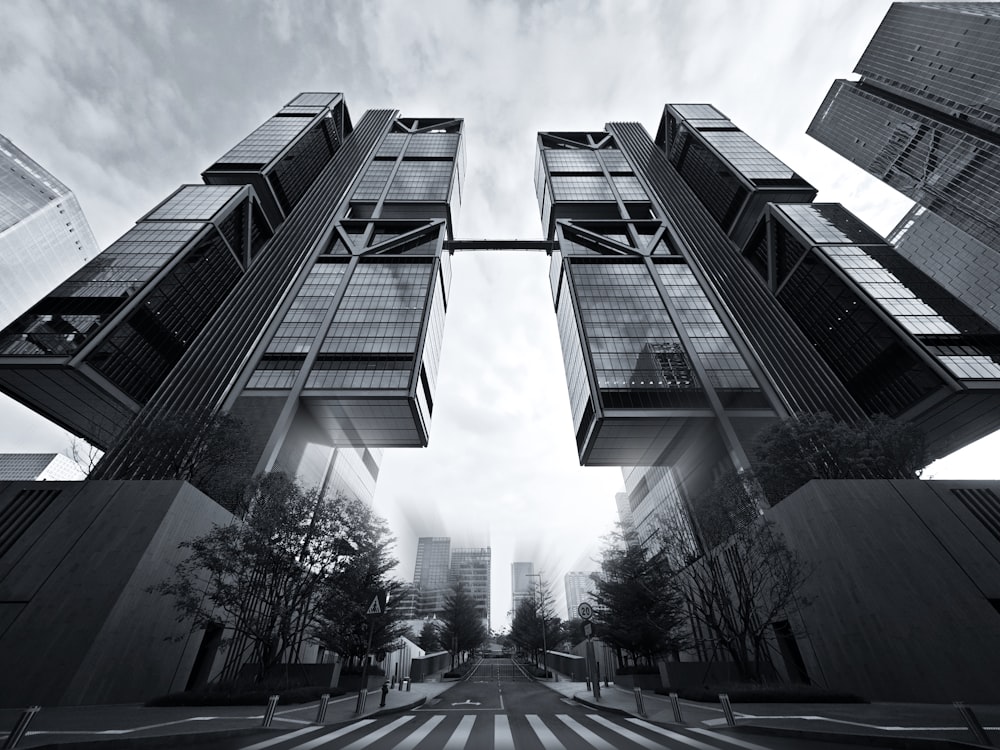 a black and white photo of two tall buildings