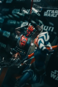 A detailed Star Wars action figure posed with a lightsaber in hand against a galactic backdrop.