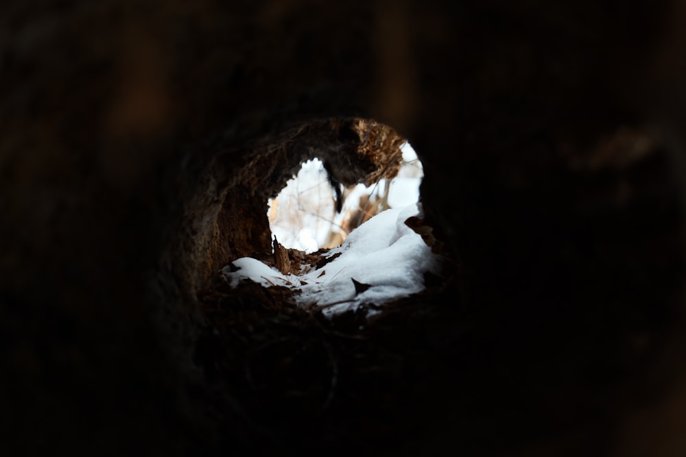 a hole in the ground with snow on the ground