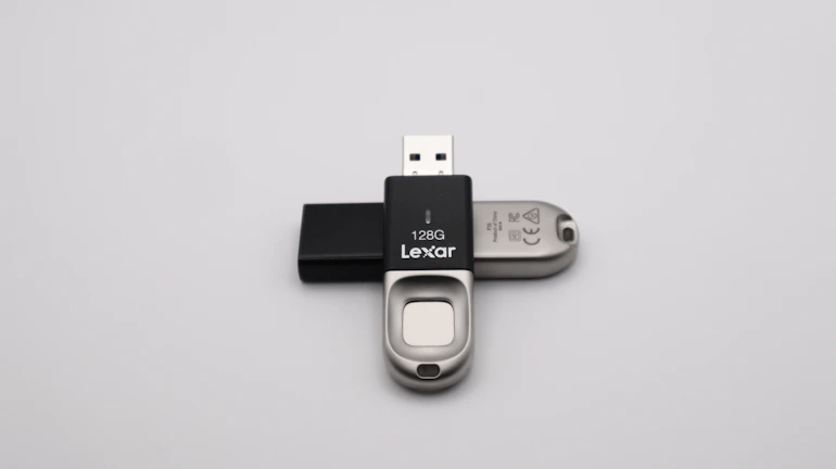 256GB metal USB drive with a brushed finish, angled to catch soft light on a dark backdrop.