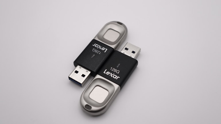 A collection of colorful USB flash drives displayed on a white background.