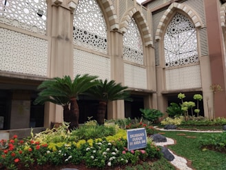 Beautiful garden space outside Karnawati Bhawan with lush greenery and seating
