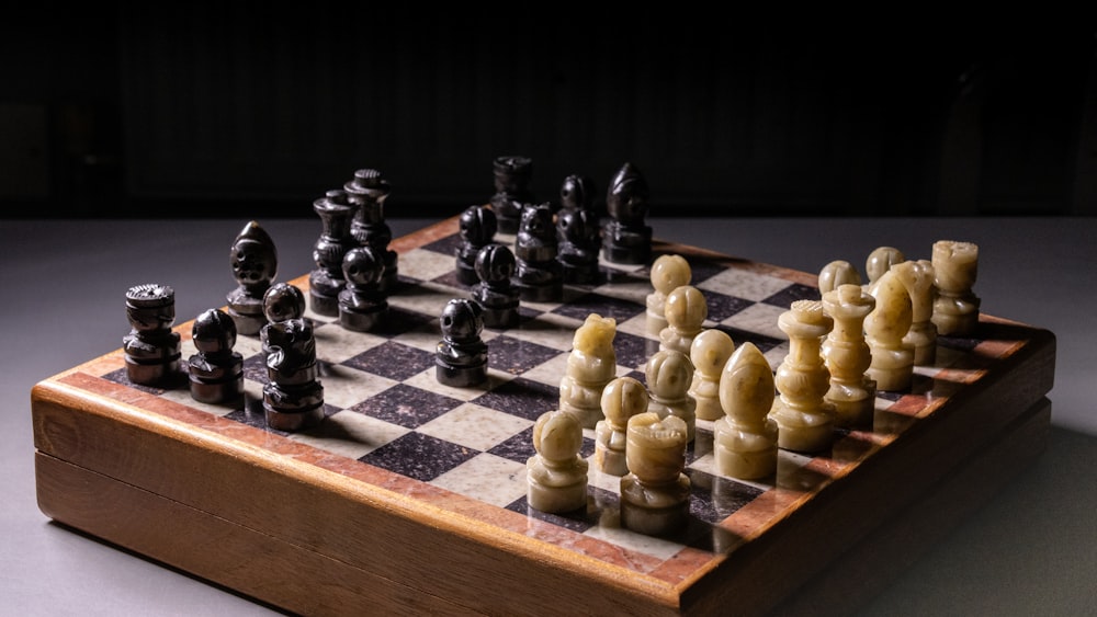 a wooden chess board with chess pieces on it