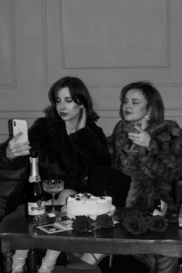 a couple of women sitting next to each other