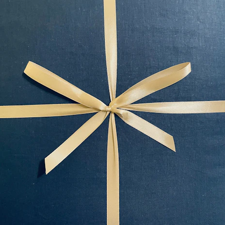 Handicraft quality assurance certificate with subtle red ribbon detail.