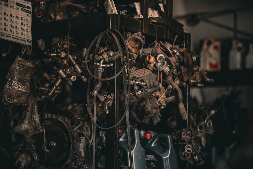 a bunch of engine parts sitting on top of a shelf