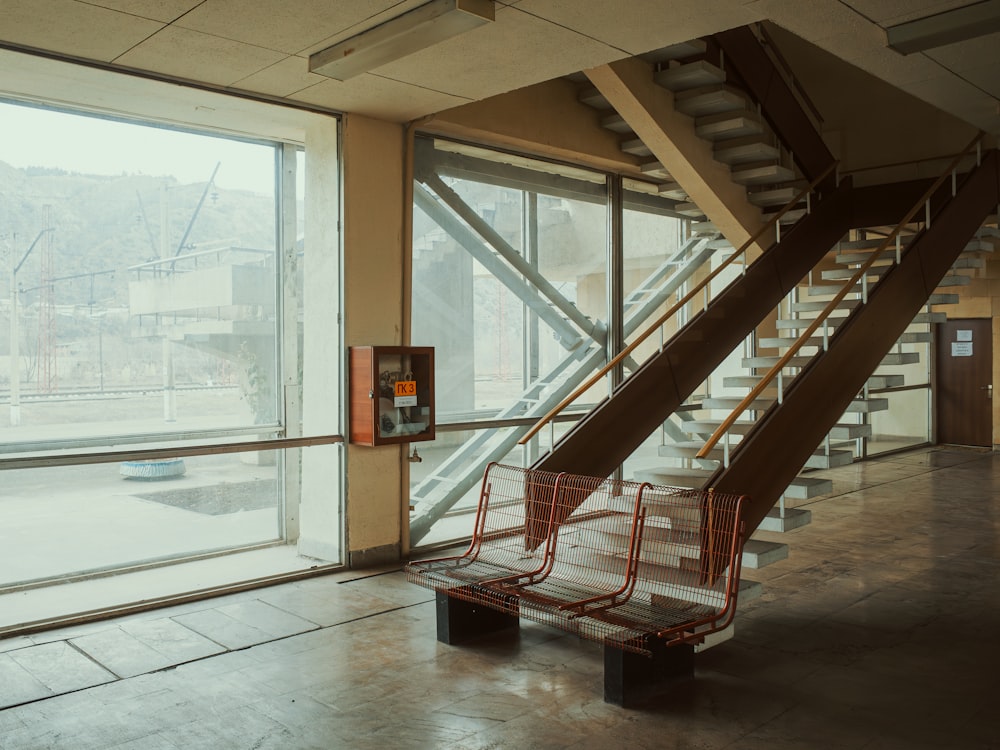 a staircase in a building with glass walls