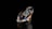 a diamond on a black background with a reflection