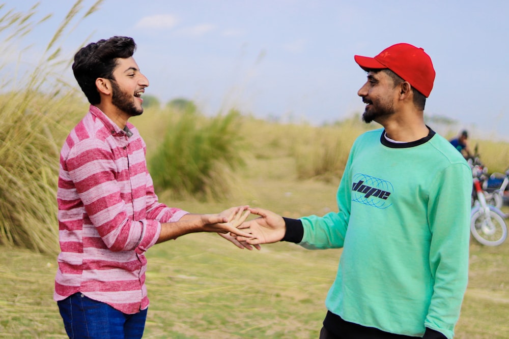 a couple of men standing next to each other