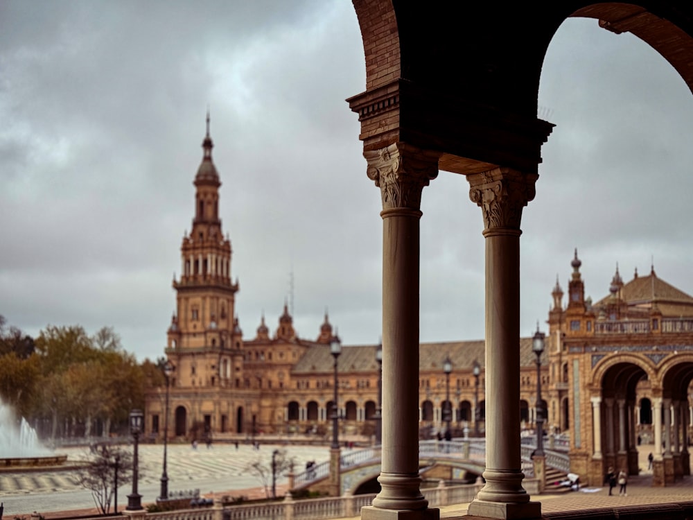 a large building with a clock tower in the background