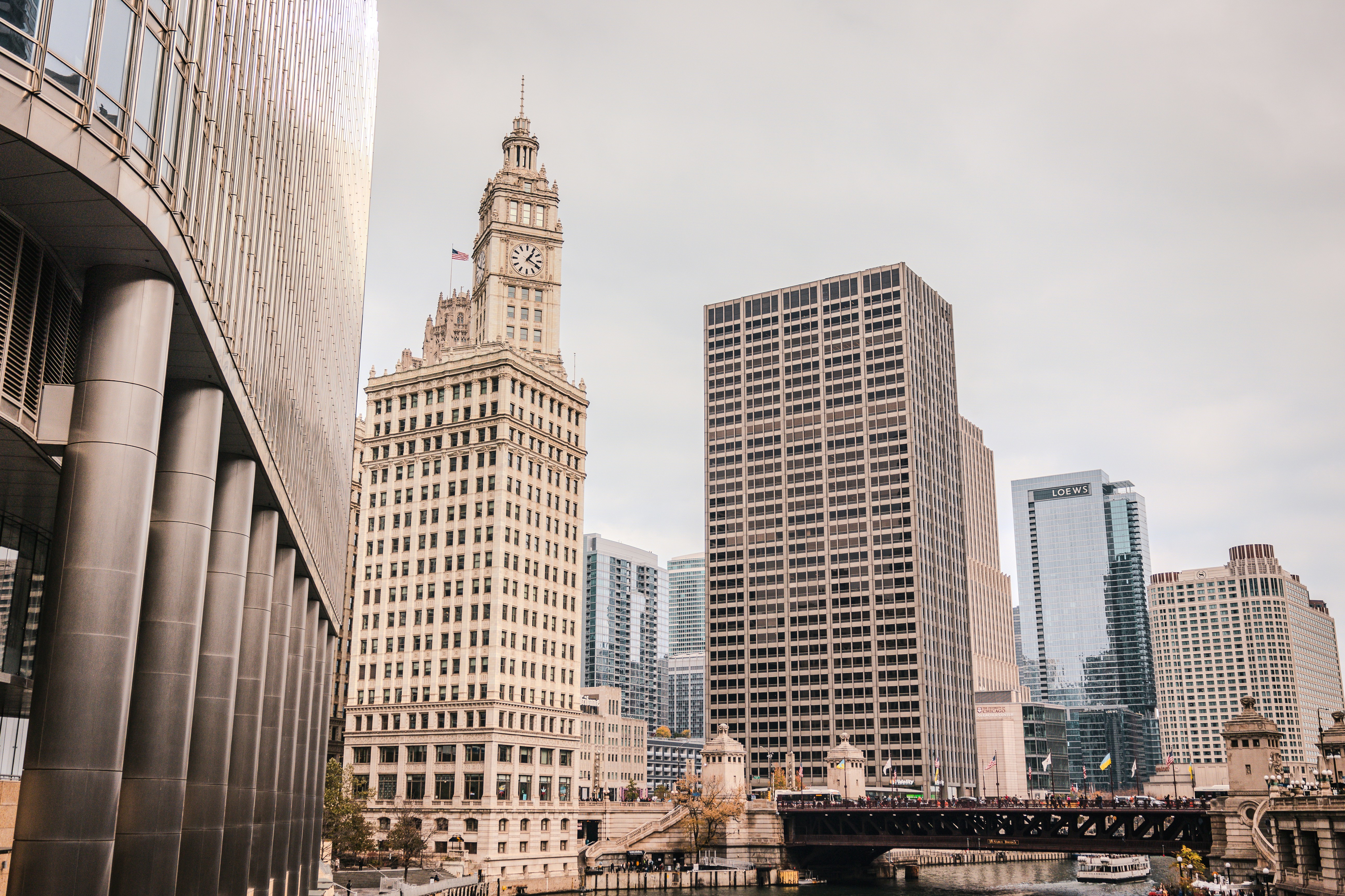 a river runs through a city with tall buildings