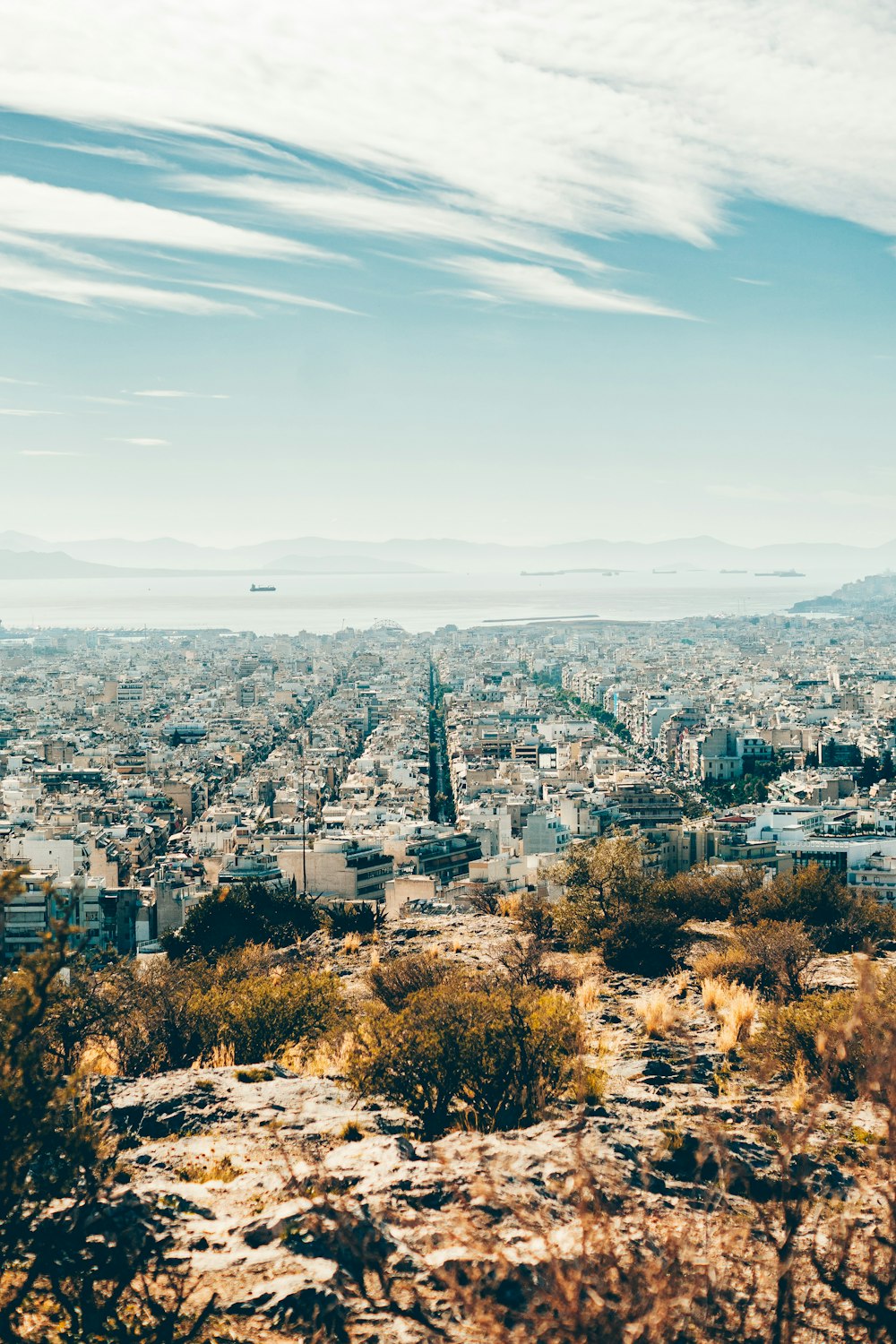 a view of a city from the top of a hill