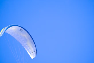 Close-up of a durable Vientoguard cover snugly fitted over a light sport powered parachute on a sunny day.