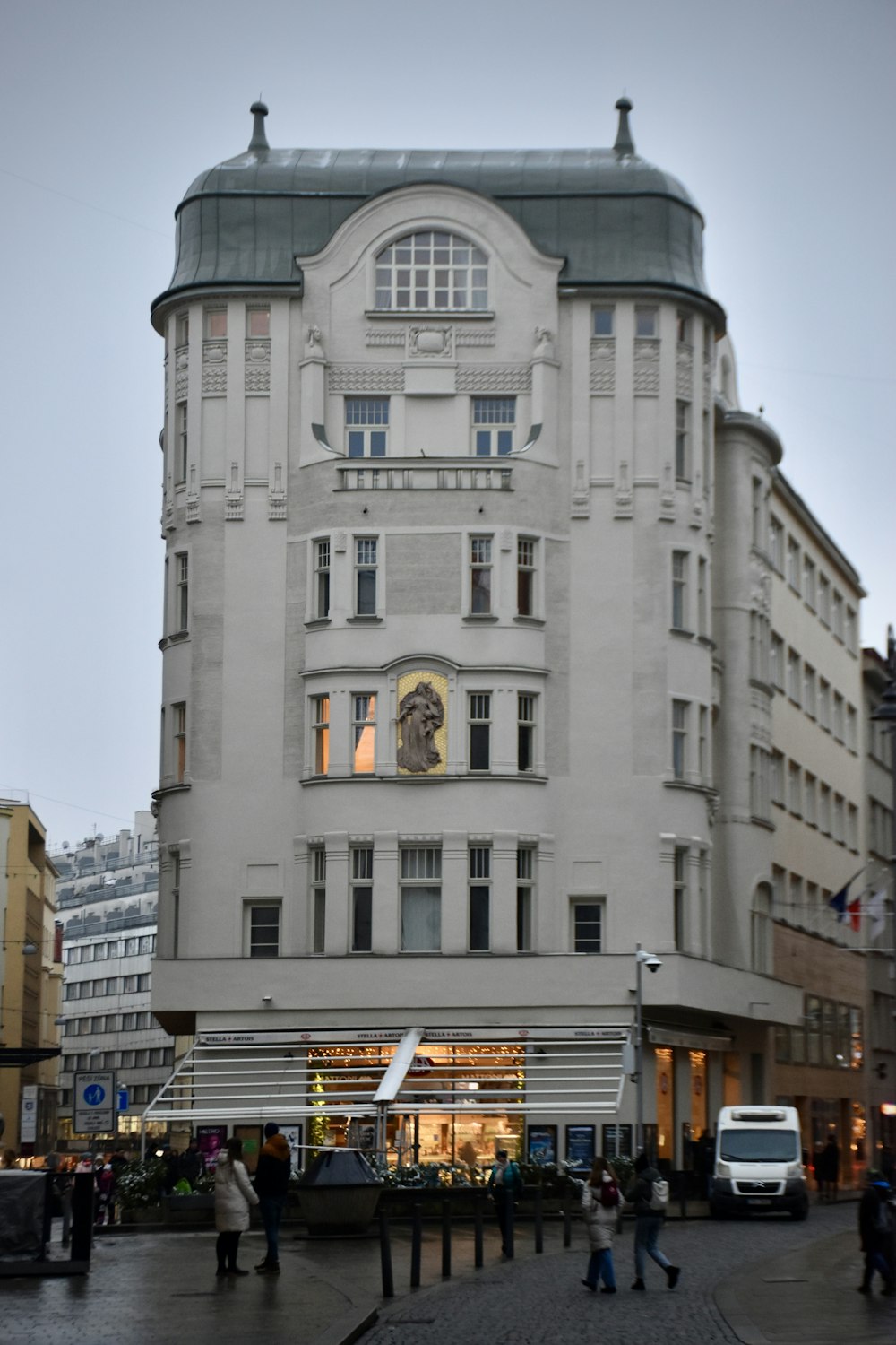 a large white building with a clock on it's face