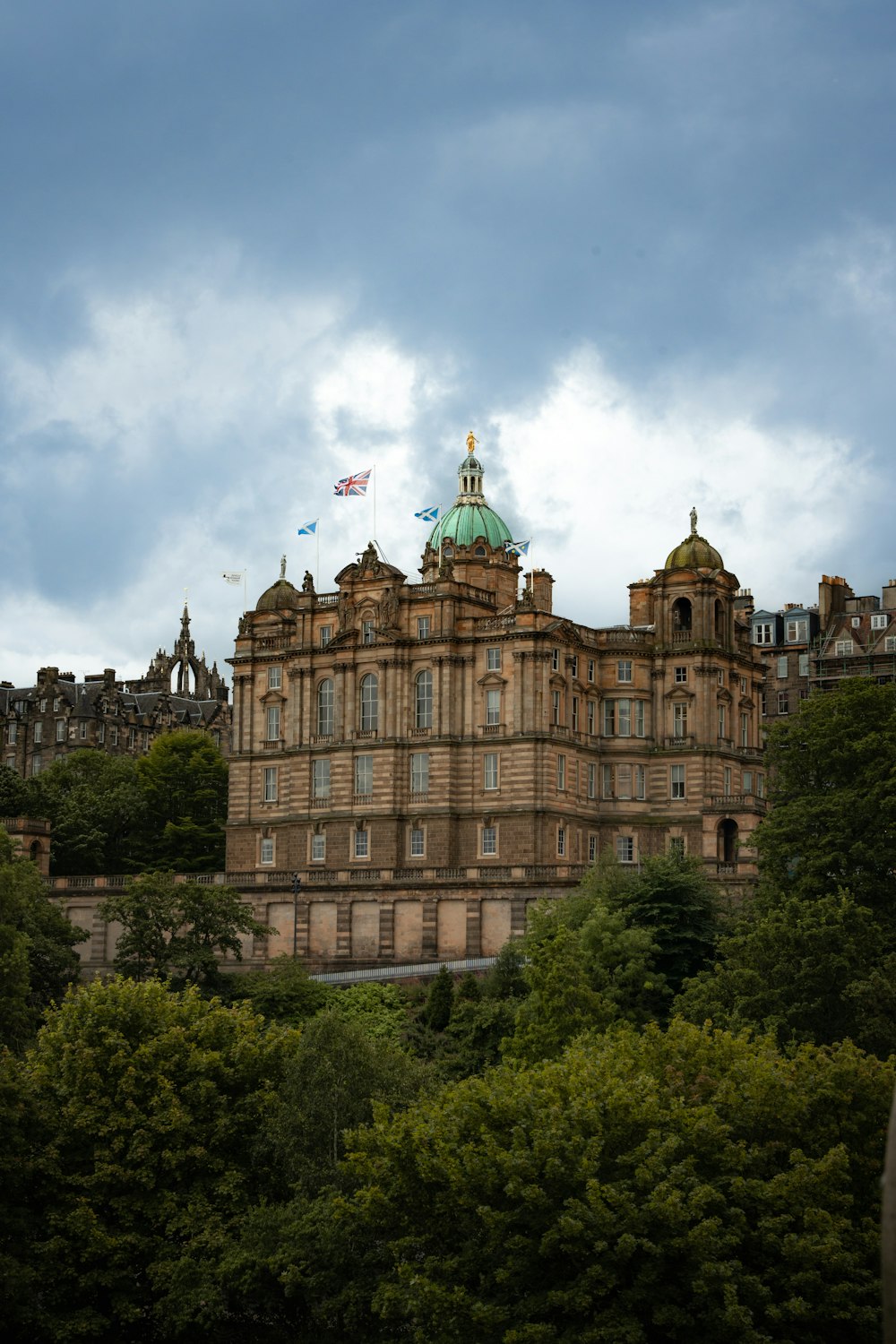 a large building with a green dome on top of it