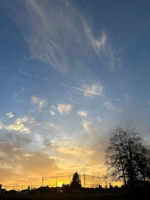 Henry Wow's poetry collection cover featuring a serene sunset.