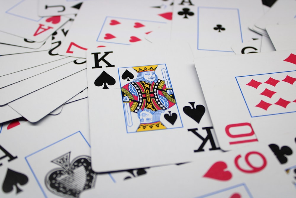 a pile of playing cards sitting on top of each other