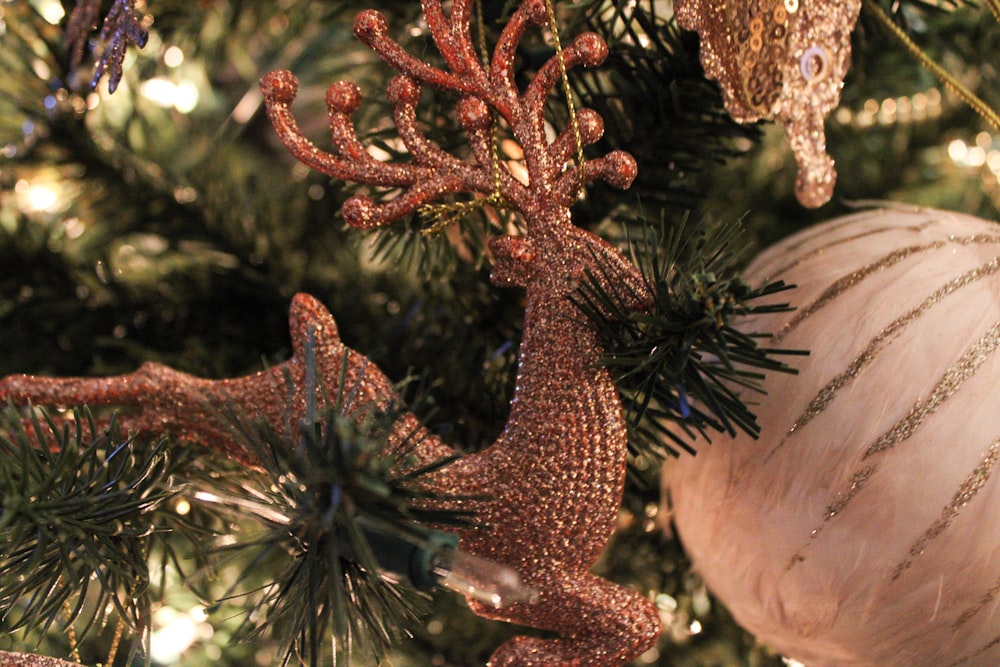 a close up of a christmas tree with ornaments