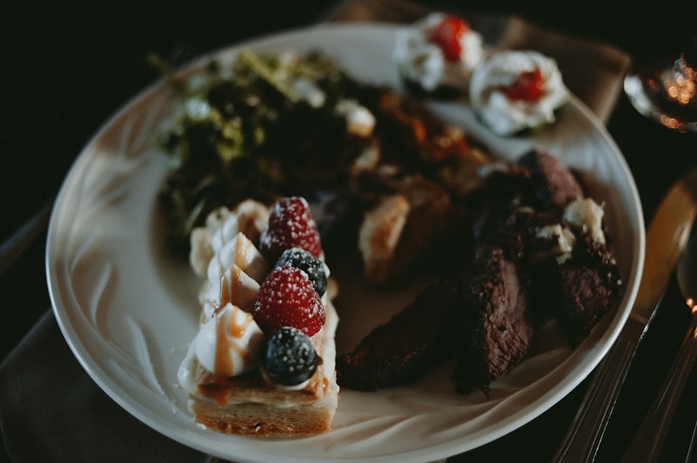 a white plate topped with food on top of a table