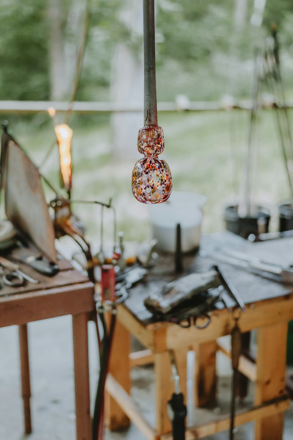 a table with a lamp hanging from it's side