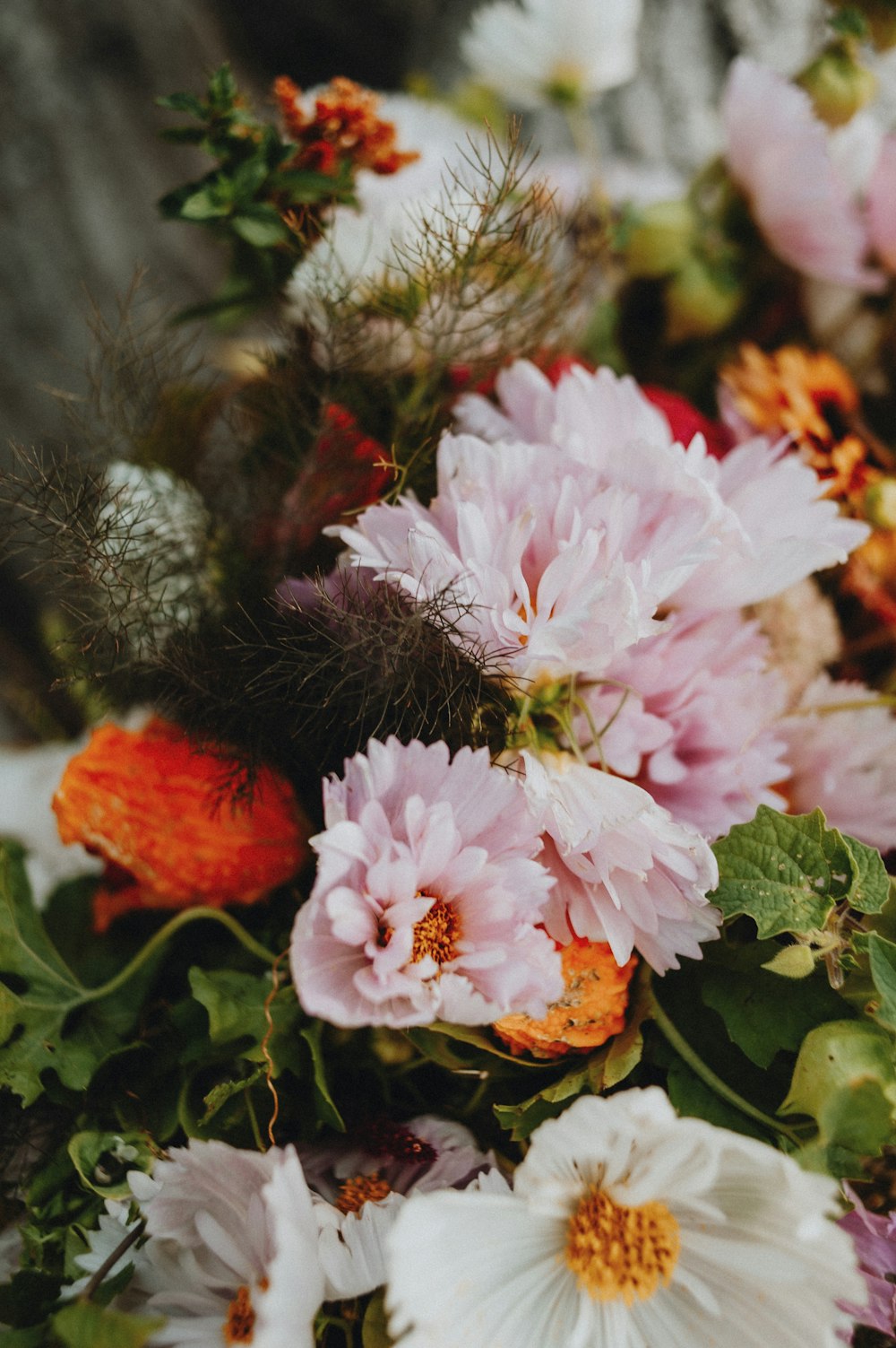 a bunch of flowers that are sitting on a table