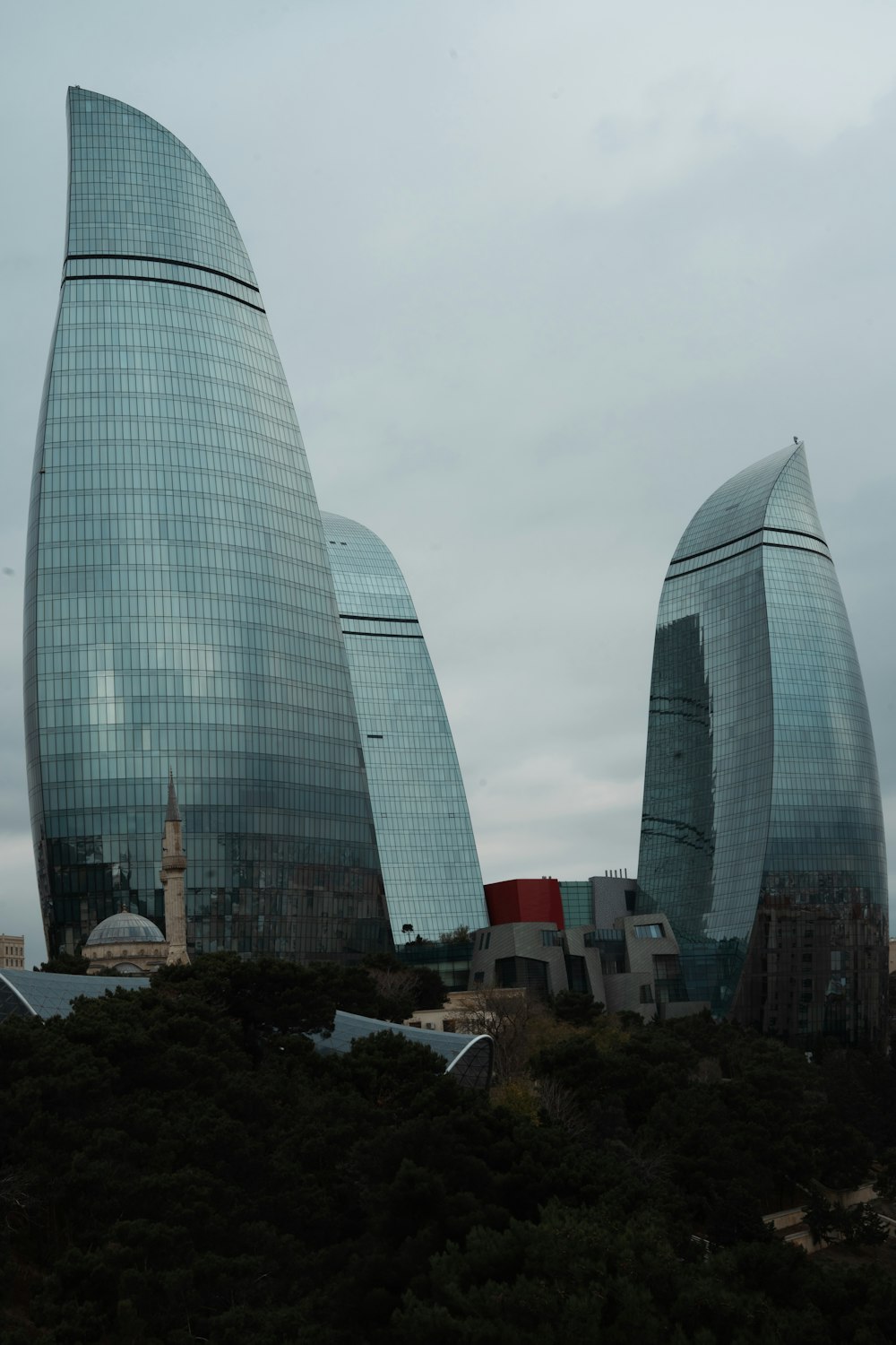 a couple of very tall buildings in a city