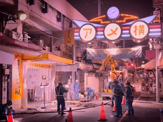 Nighttime shot of a moving crew working efficiently under bright lights, demonstrating 24/7 service.